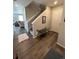 Inviting foyer boasts wood floors and a staircase, creating a warm welcome to this charming home at 12901 Crane River Dr, Longmont, CO 80504