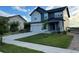 Two-story home with an attached garage, neat front lawn and close proximity to neighboring homes at 12901 Crane River Dr, Longmont, CO 80504
