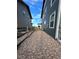 Side yard featuring gravel landscaping, offering a low-maintenance and aesthetically pleasing outdoor space at 12901 Crane River Dr, Longmont, CO 80504