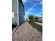 Side yard with gravel landscaping, offering low maintenance with a rustic, natural aesthetic at 12901 Crane River Dr, Longmont, CO 80504