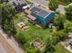 Aerial view of a large backyard with a fire pit, garden, and storage shed at 10978 Roseanna Dr, Northglenn, CO 80234