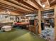 Spacious basement area with exposed wood ceilings, a pool table, and comfortable seating at 10978 Roseanna Dr, Northglenn, CO 80234