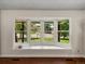 Bright bay window with built-in seating and view of the front yard at 10978 Roseanna Dr, Northglenn, CO 80234