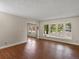 Spacious living room with hardwood floors and large bay windows at 10978 Roseanna Dr, Northglenn, CO 80234