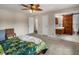 Cozy bedroom with barn door access to a modernly designed bathroom at 10978 Roseanna Dr, Northglenn, CO 80234