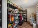 Walk-in pantry features ample shelving for food storage and organization at 10978 Roseanna Dr, Northglenn, CO 80234