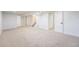 Spacious finished basement with new carpet and neutral paint at 2280 Sherrelwood Dr, Denver, CO 80221