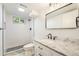 Modern bathroom with walk-in shower and updated vanity at 2280 Sherrelwood Dr, Denver, CO 80221