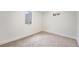 Basement bedroom featuring new carpet and natural light at 2280 Sherrelwood Dr, Denver, CO 80221