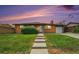 Charming brick home with a well-maintained front yard and inviting walkway at 2280 Sherrelwood Dr, Denver, CO 80221