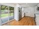 Modern kitchen with stainless steel appliances and easy access to an outdoor patio at 2280 Sherrelwood Dr, Denver, CO 80221