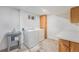 Functional laundry room with modern appliances and utility sink at 2280 Sherrelwood Dr, Denver, CO 80221