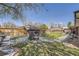Large backyard with a patio, outdoor grilling area, a charming garden, and a grassy lawn at 3383 S Ogden St, Englewood, CO 80113