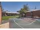 Backyard featuring a private basketball court, brick accents, and spacious yard at 3383 S Ogden St, Englewood, CO 80113