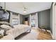 Relaxing bedroom with two windows, neutral tones, a ceiling fan, and hardwood floors at 3383 S Ogden St, Englewood, CO 80113