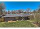 Charming brick ranch with a well-maintained lawn and tasteful landscaping at 3383 S Ogden St, Englewood, CO 80113