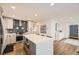 Well-appointed kitchen with a center island, ample counter space, and sleek stainless steel appliances at 3383 S Ogden St, Englewood, CO 80113