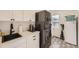 Well-organized laundry room with modern washer/dryer, white cabinets, and a functional sink area at 3383 S Ogden St, Englewood, CO 80113