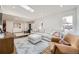 Bright living room with a large sectional sofa, skylight, and a comfortable seating area at 3383 S Ogden St, Englewood, CO 80113