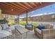 Comfortable outdoor seating area with stylish furnishings, hanging chair, and covered patio at 3383 S Ogden St, Englewood, CO 80113