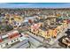 Colorful townhomes in an aerial view showcase a vibrant community with modern architectural details at 801 Confidence Dr # 16, Longmont, CO 80504