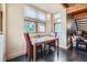 Cozy dining area with bright windows and contemporary furnishings at 801 Confidence Dr # 16, Longmont, CO 80504