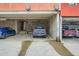 Spacious garage with multiple parking spaces and brick walls at 801 Confidence Dr # 16, Longmont, CO 80504