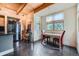 Bright kitchen features wood ceiling, stainless steel appliances, dining table near windows, and polished concrete floors at 801 Confidence Dr # 16, Longmont, CO 80504
