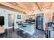 Modern kitchen features an island with bar seating and stainless steel appliances at 801 Confidence Dr # 16, Longmont, CO 80504