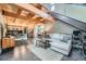 Spacious living area with wood beams and stairs, open to the kitchen and dining areas at 801 Confidence Dr # 16, Longmont, CO 80504