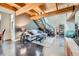 Open concept living space with modern furnishings and wooden beam ceilings at 801 Confidence Dr # 16, Longmont, CO 80504