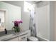 Inviting bathroom featuring a combination bathtub and shower, a white vanity, and modern fixtures at 695 Simmental Loop, Castle Rock, CO 80104