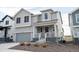 Charming two-story home showcasing a modern design, a well-kept yard, and an attached single car garage at 695 Simmental Loop, Castle Rock, CO 80104