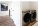 Convenient laundry room with side-by-side washer and dryer on the second floor at 695 Simmental Loop, Castle Rock, CO 80104