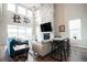 Inviting living room features a floor-to-ceiling stone fireplace, large windows, and stylish decor at 695 Simmental Loop, Castle Rock, CO 80104