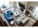 Open living room with fireplace, high ceilings, neutral walls, and a glass slider to an outdoor patio at 695 Simmental Loop, Castle Rock, CO 80104