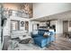 Bright open-concept living room featuring modern decor, high ceilings, and seamless integration with kitchen area at 695 Simmental Loop, Castle Rock, CO 80104