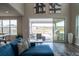 Living room with sliding glass doors to an outdoor covered patio and grill at 695 Simmental Loop, Castle Rock, CO 80104