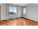 A bright and airy bedroom with natural light, hardwood floors, and radiant heating at 14440 Eagle Vista Dr, Littleton, CO 80127