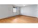 Bedroom featuring light hardwood floors and modern shelving at 14440 Eagle Vista Dr, Littleton, CO 80127