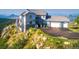 Stunning hillside home with stone accents, three car garage, and mountain views at 14440 Eagle Vista Dr, Littleton, CO 80127