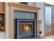 Close-up of a cozy fireplace with a decorative wooden mantle and tile surround at 14440 Eagle Vista Dr, Littleton, CO 80127