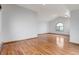 Bright and airy living room with hardwood floors and modern lighting at 14440 Eagle Vista Dr, Littleton, CO 80127