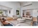 Spacious living room featuring hardwood floors, neutral tones, and abundant natural light at 14440 Eagle Vista Dr, Littleton, CO 80127