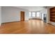 Open living room with hardwood floors, bay window and custom built-ins at 14440 Eagle Vista Dr, Littleton, CO 80127