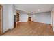 Large living room with hardwood floors and custom shelving at 14440 Eagle Vista Dr, Littleton, CO 80127