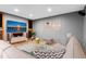 Cozy living room with large screen tv and comfortable seating at 14440 Eagle Vista Dr, Littleton, CO 80127