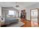 A spacious main bedroom with hardwood floors, a fireplace, and large windows at 14440 Eagle Vista Dr, Littleton, CO 80127