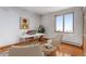 Bright office space features natural light, desk, chair, and wood floors at 14440 Eagle Vista Dr, Littleton, CO 80127