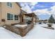 Backyard patio with pergola, grill, and seating area at 42280 Kingsmill Cir, Elizabeth, CO 80107